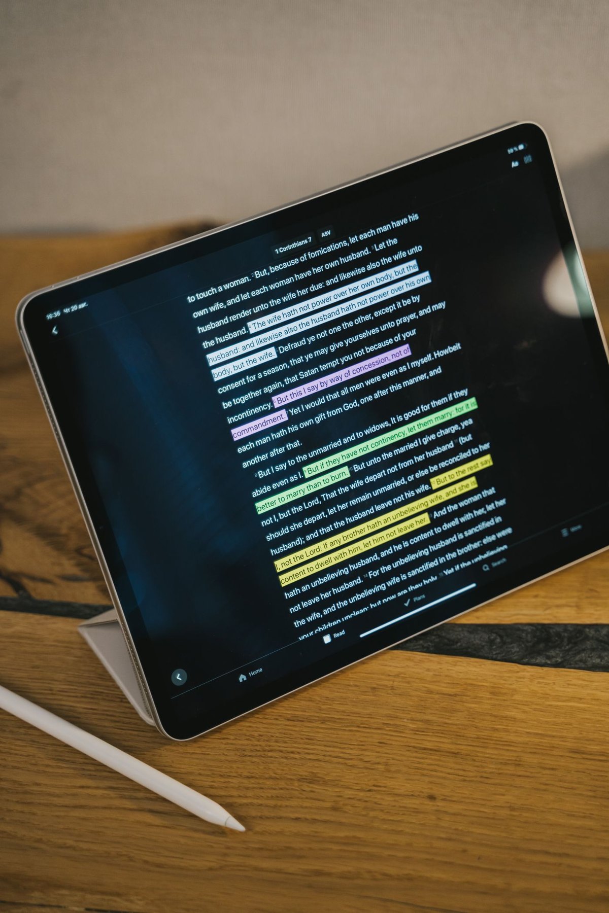 Tablet displaying highlighted text beside a stylus