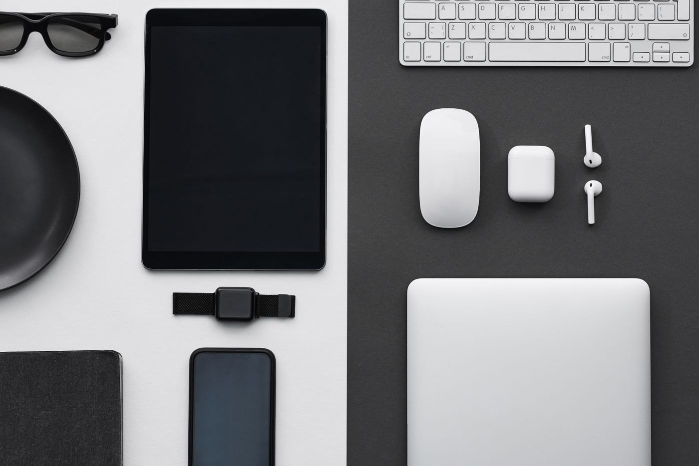 Tablet and laptop arranged with desk accessories