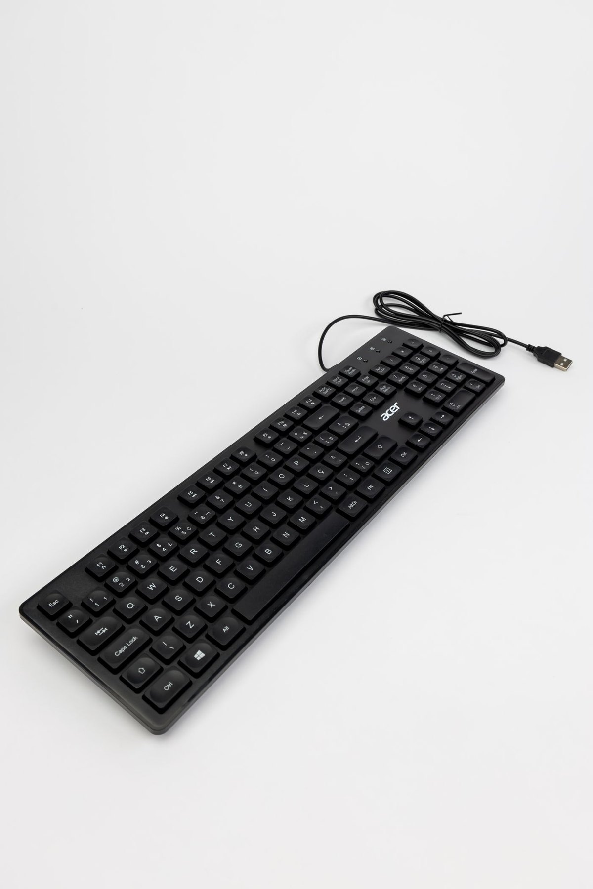 Full-size wired keyboard on a light background