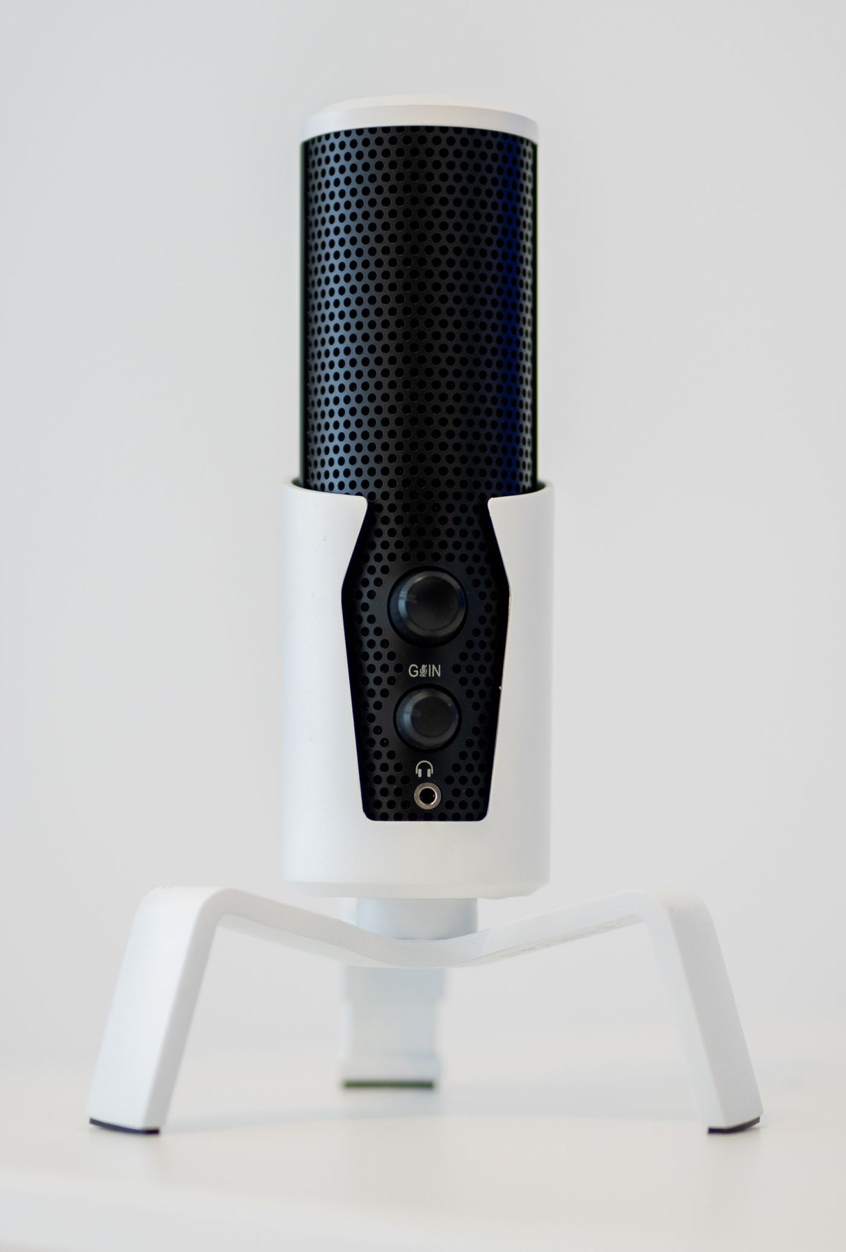 Desktop microphone on a small white stand