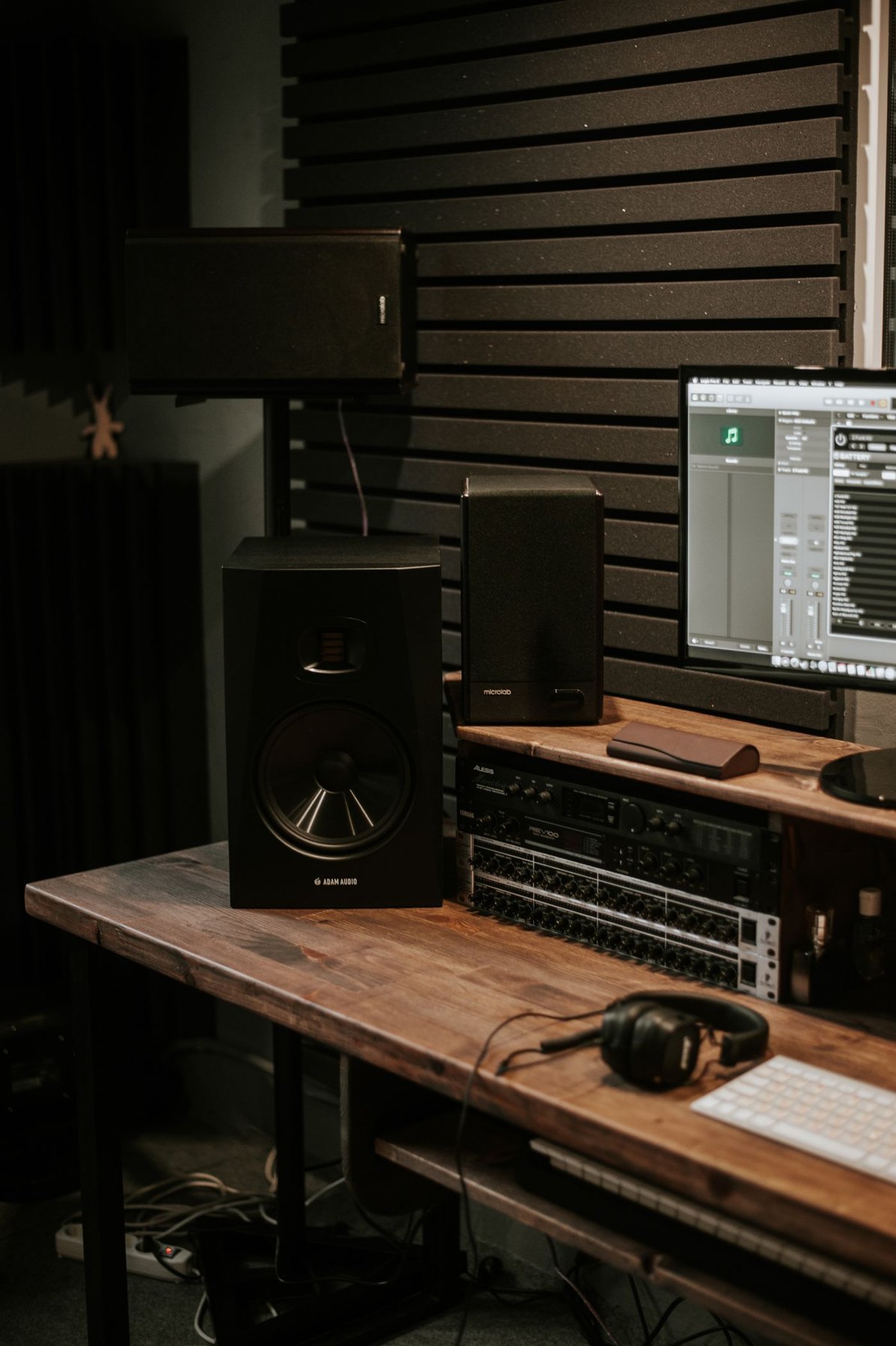 Desktop speakers arranged beside a computer screen