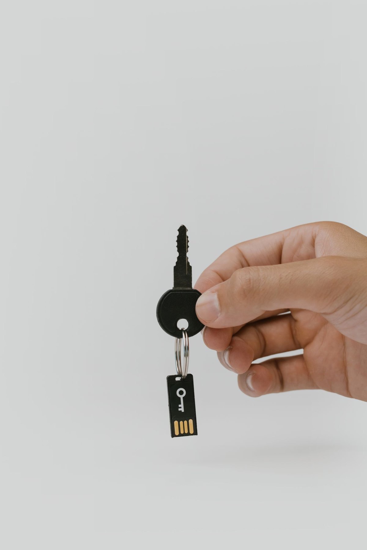 Small USB flash drive attached to a key ring